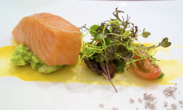 Confit salmon, salad of greens and tomato, and a thin layer of egg yolk