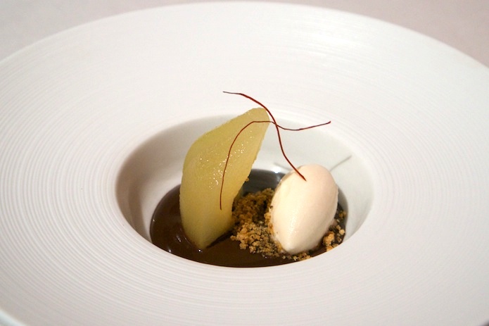 Poached pear, ice cream, chocolate and slivers of dried peppers
